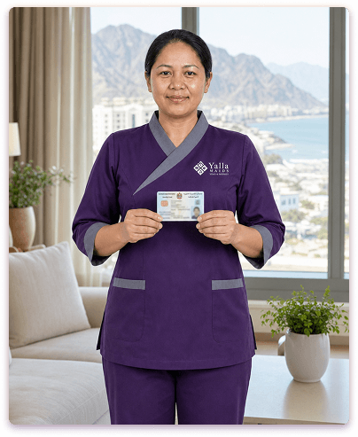 Yalla Maids uniformed maid holding Emirates ID for visa transfer